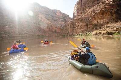 Students in inflatable kayaks on a Southwest river with Outdoor Pursuits